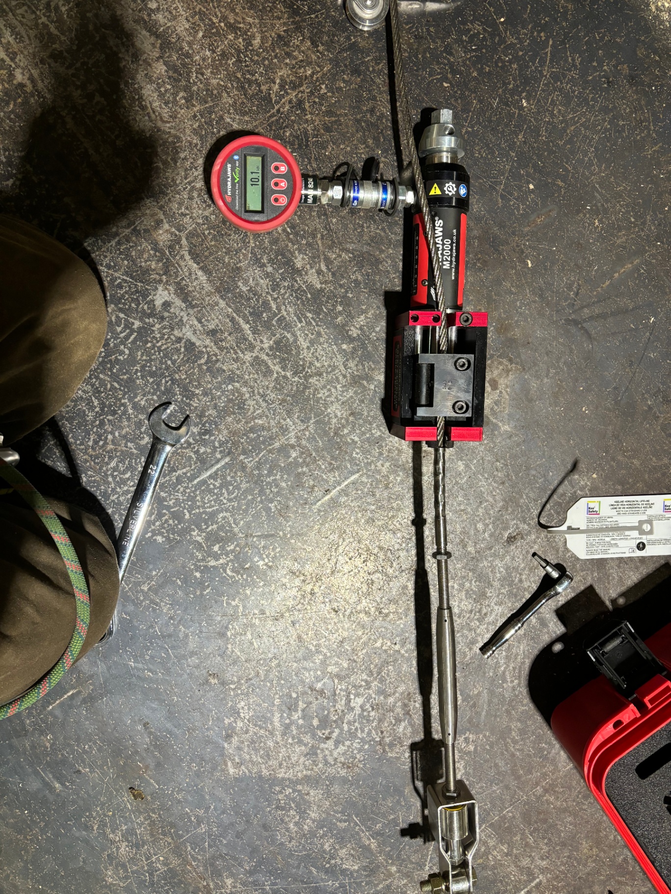 Hydrajaws M2000 pull tester applied to a swaged cable termination at a turnbuckle assembly